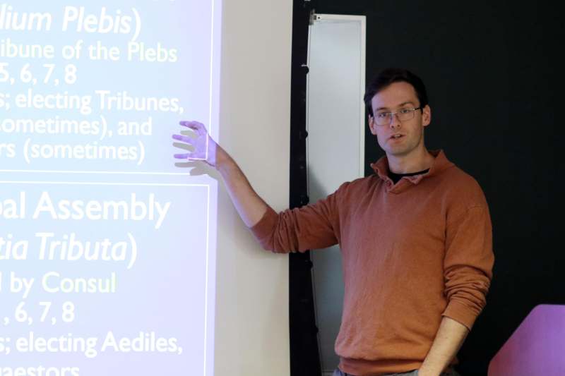 a man pointing at a screen