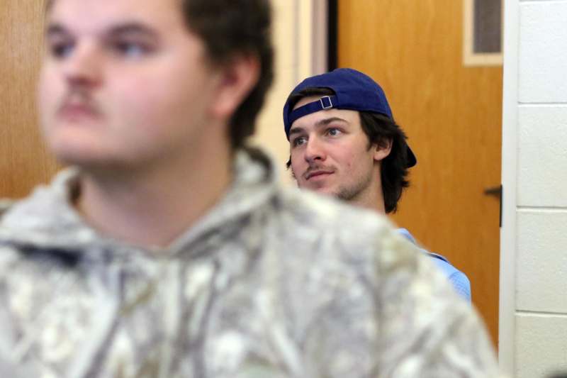 a group of men looking at something