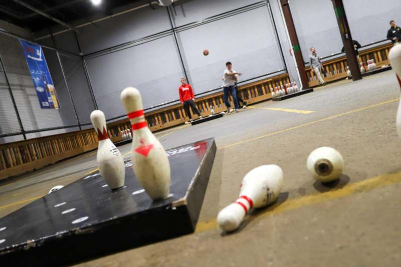 a group of people playing bowling