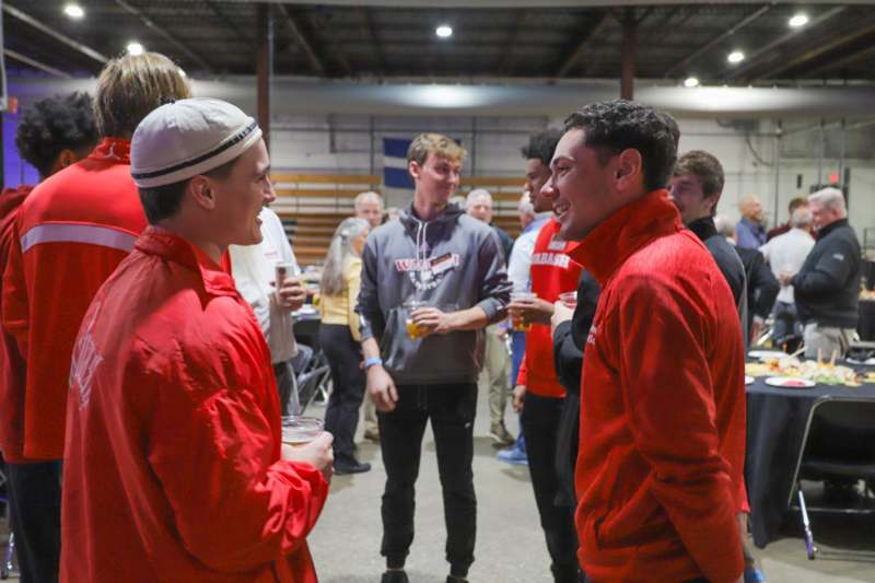 a group of men in red jackets