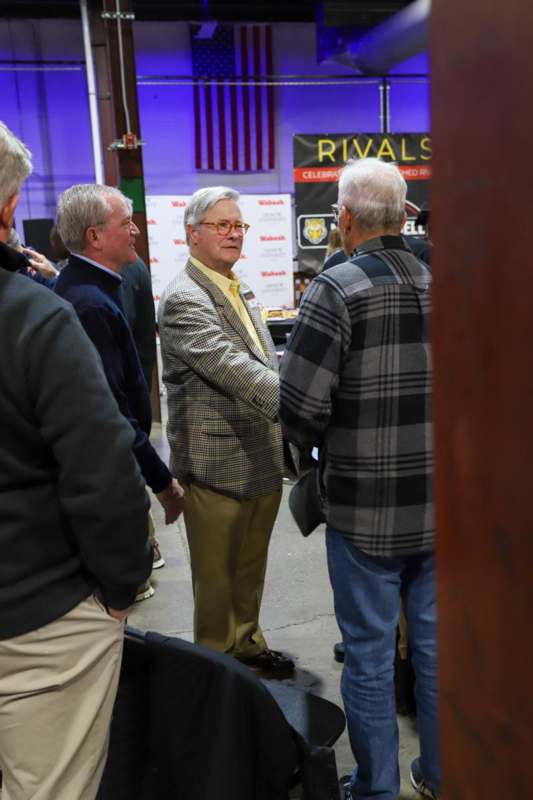 a group of men standing in a room