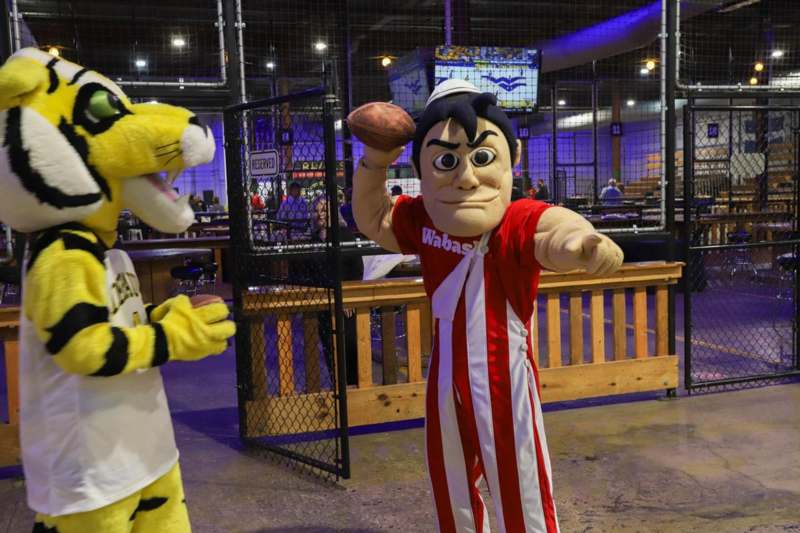 two people in clothing in a sports arena