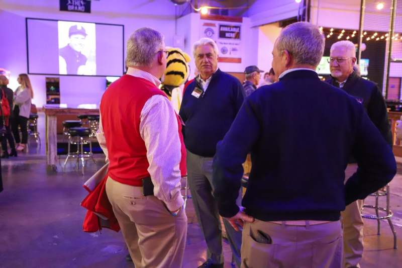 a group of men standing in a room