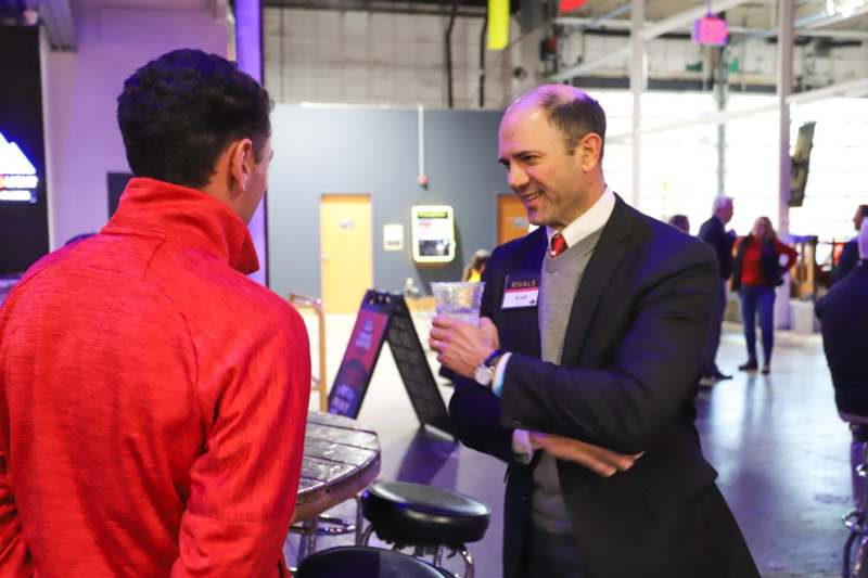 a man talking to another man