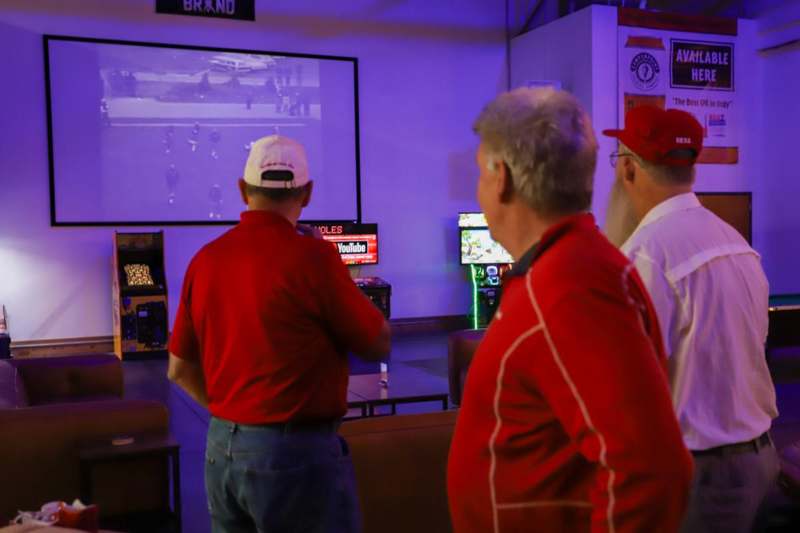a group of men playing video games