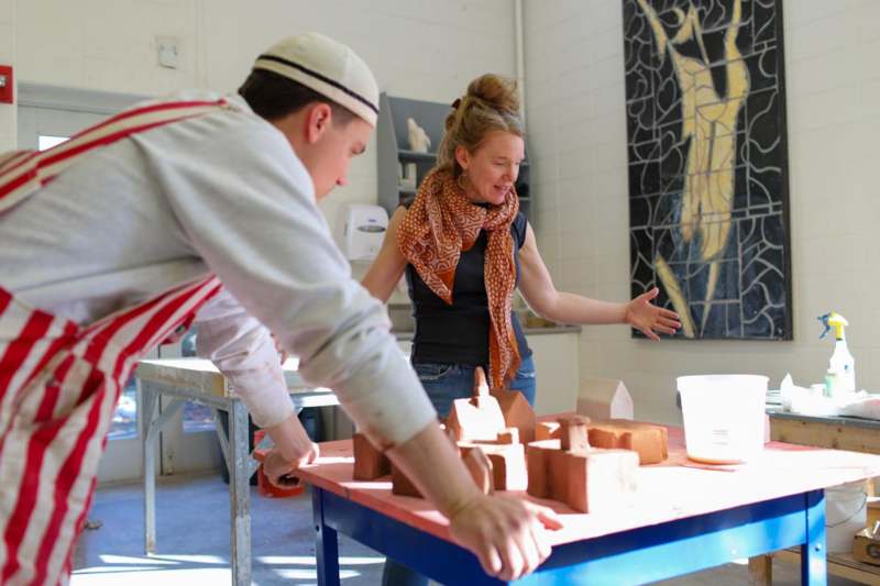 Classroom: ART 223 with Professor Annie Strader - a man and woman working on a model