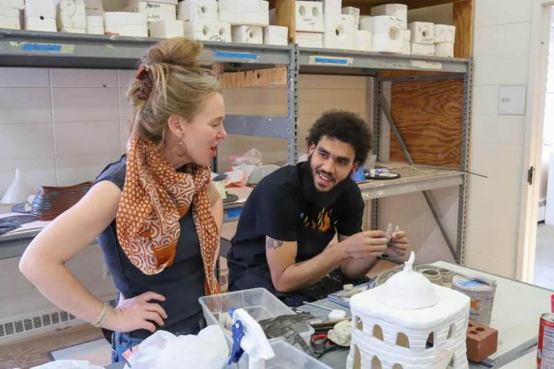 a man and woman in a workshop