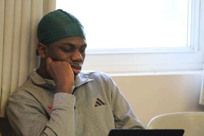 a man with his hand on his chin