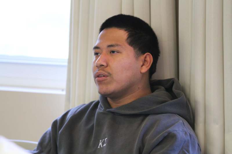 a man in a grey sweatshirt