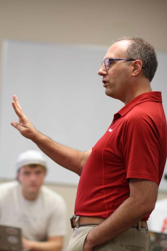 a man in a red shirt