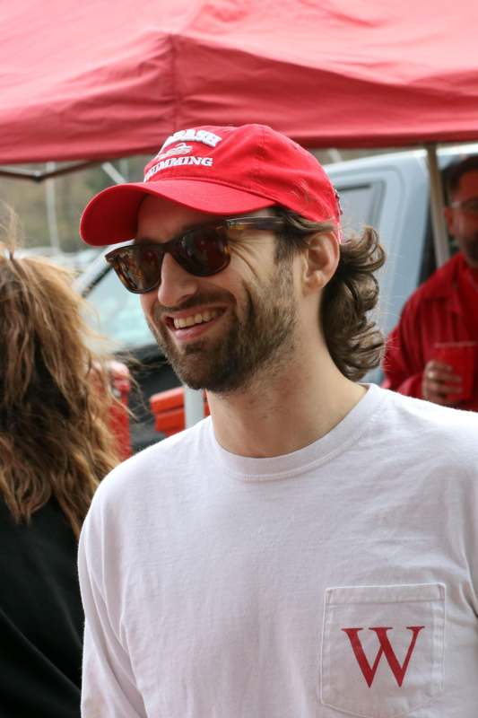a man wearing a red hat and sunglasses