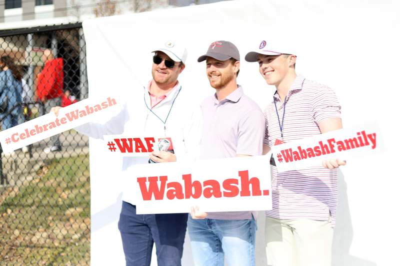 a group of men holding signs