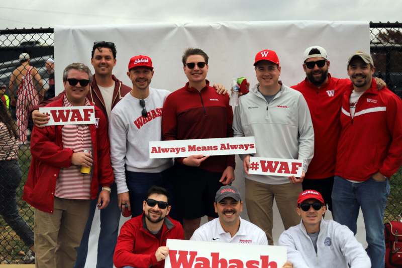 a group of men posing for a photo