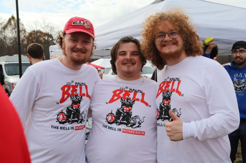 a group of men wearing white shirts