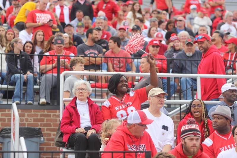 a group of people in red shirts