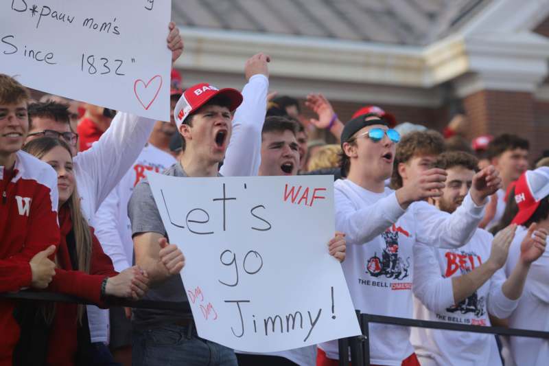 a group of people holding signs