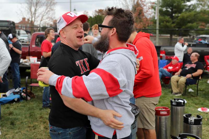a man hugging another man