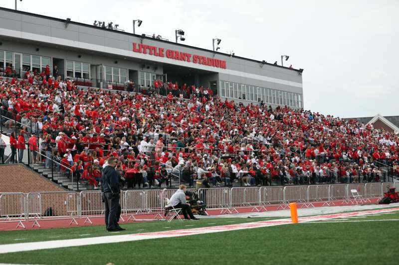 Fanfare from the 131st Monon Bell Classic - a crowd of people in a stadium