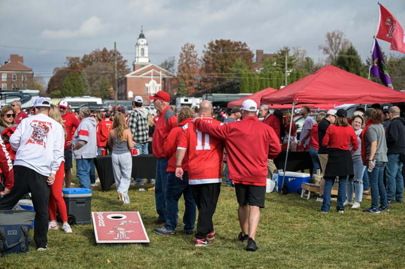 a group of people in red shirts