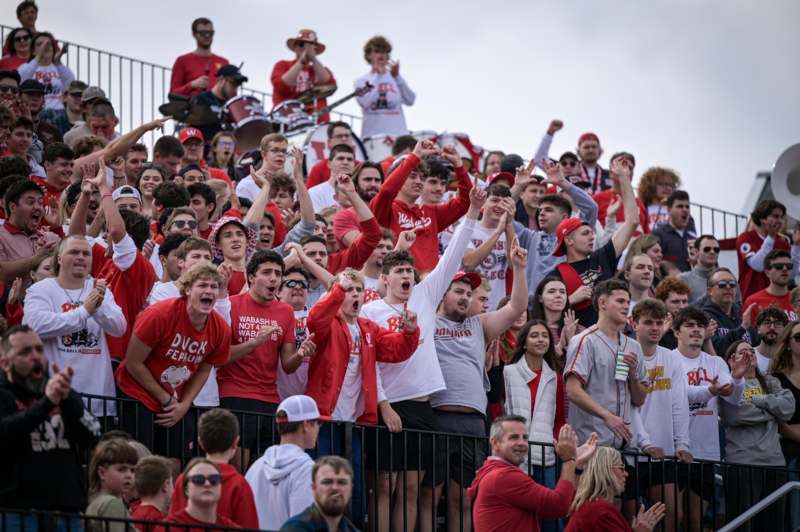 a crowd of people in red shirts