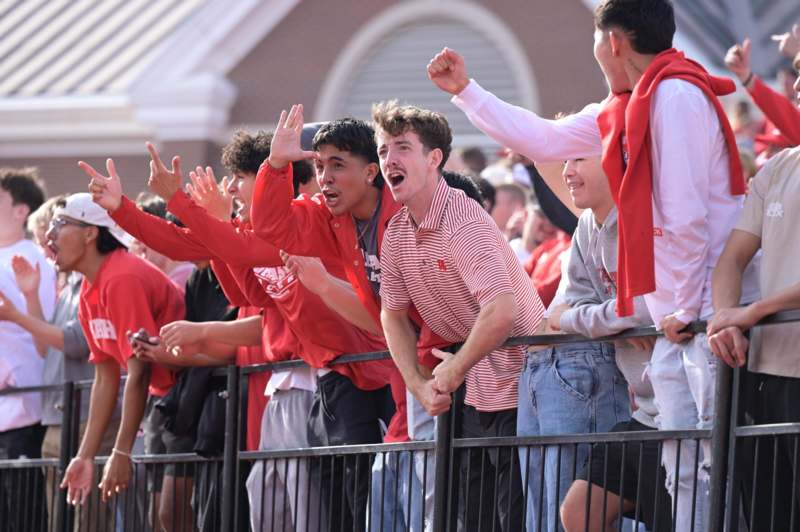a group of people in red shirts