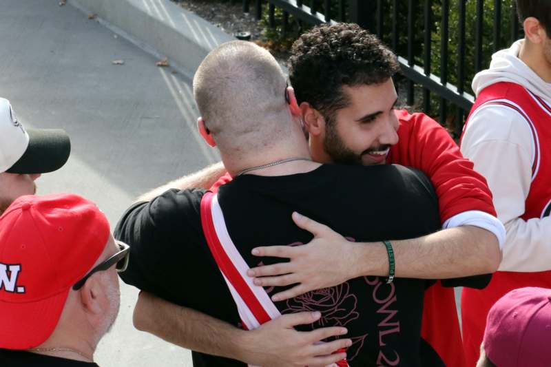 a group of men hugging