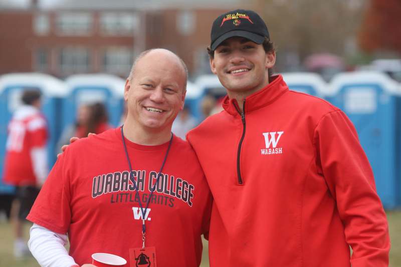 two men wearing red shirts