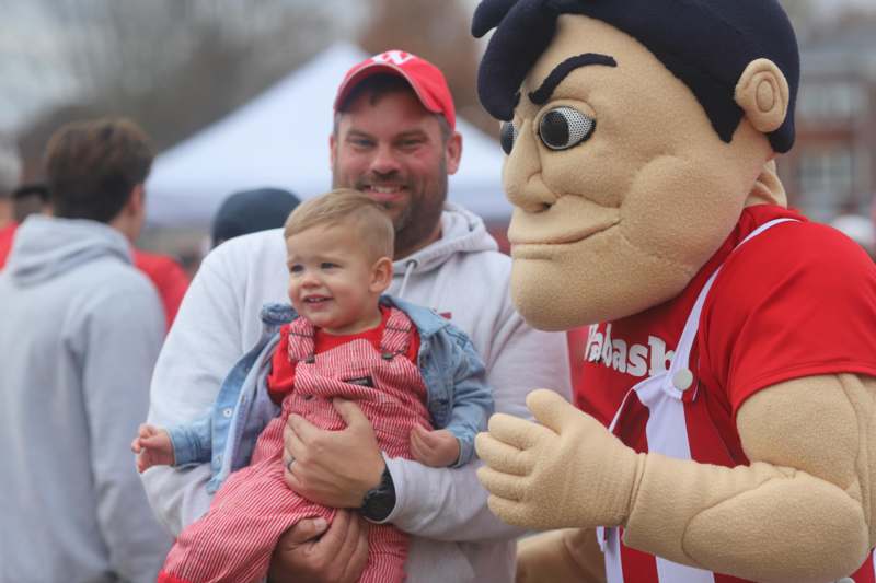 a man holding a baby