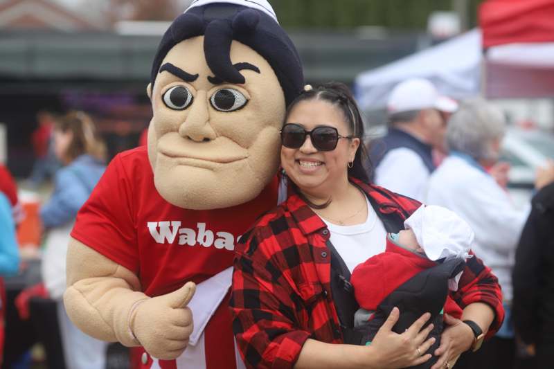 a woman holding a baby