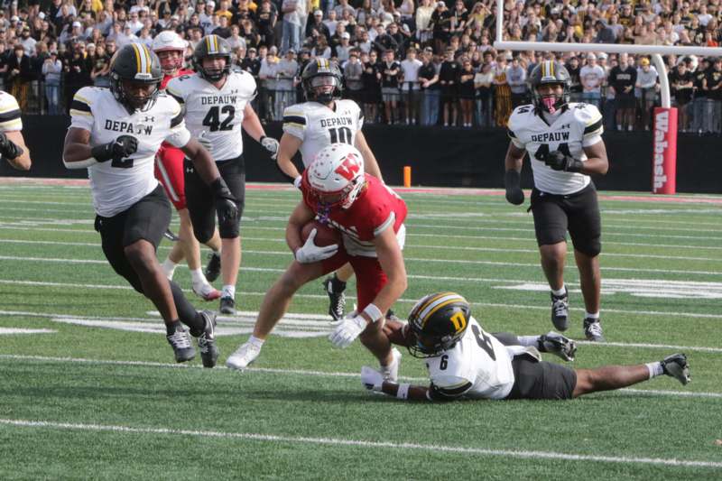 a football player running with the ball