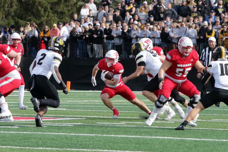 a group of people playing football