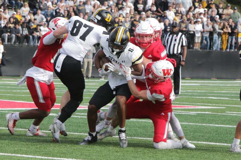 a group of people playing football