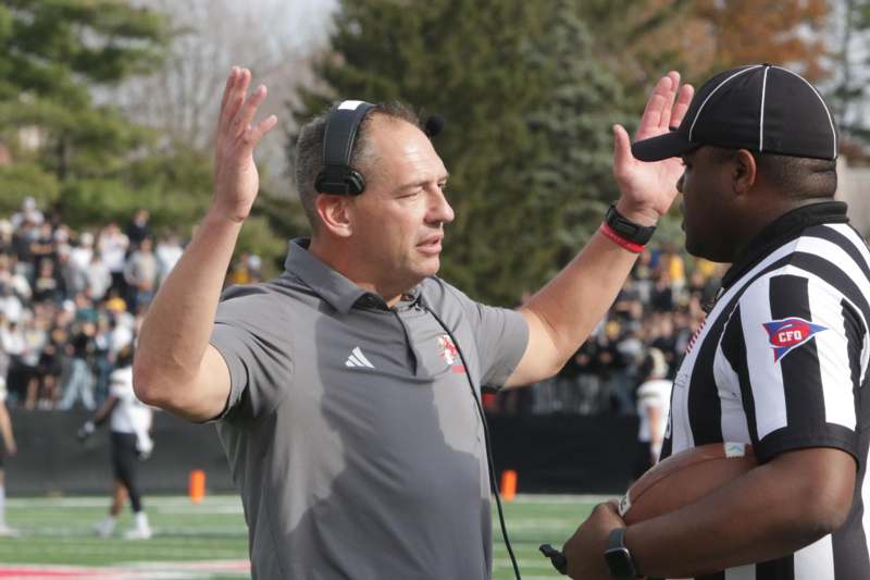 a man with a football and a football player