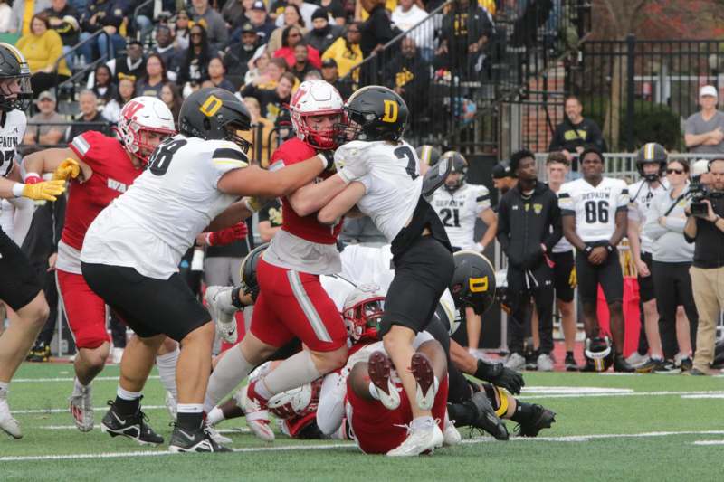 a group of people playing football