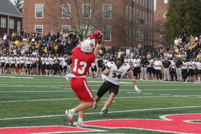a football player catching a football
