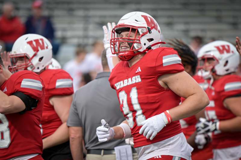 a football player in a red uniform