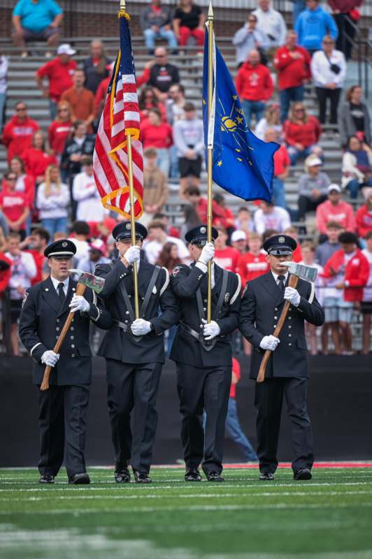 a group of police officers holding flags