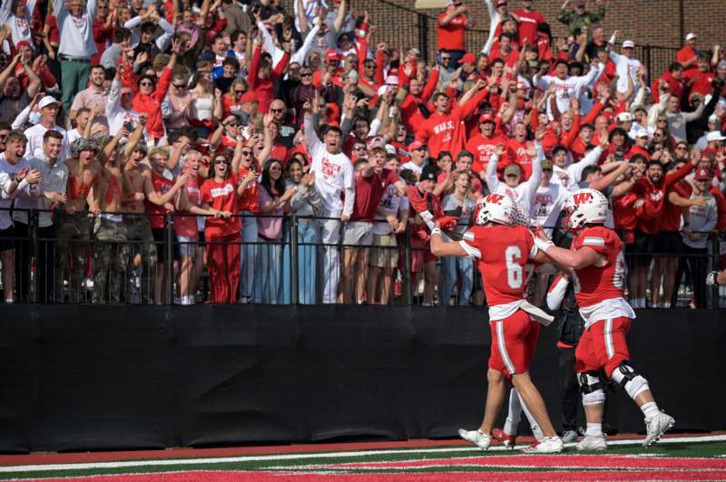 a group of people in red uniforms