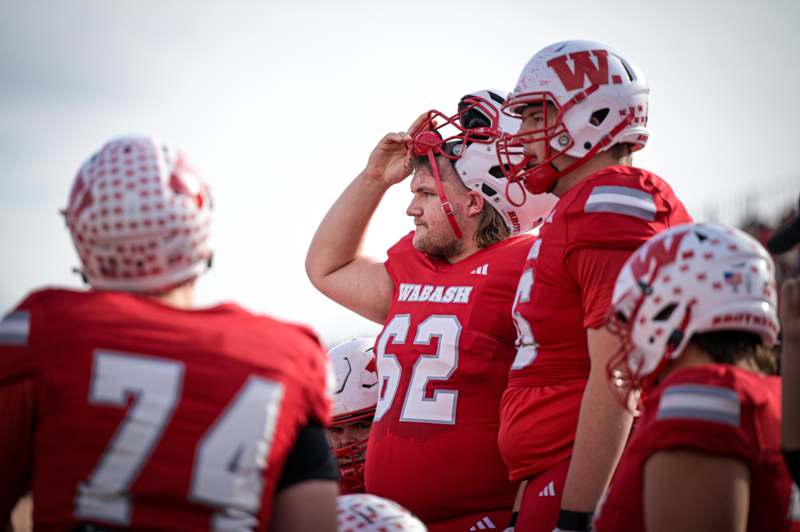 a group of football players in red uniforms
