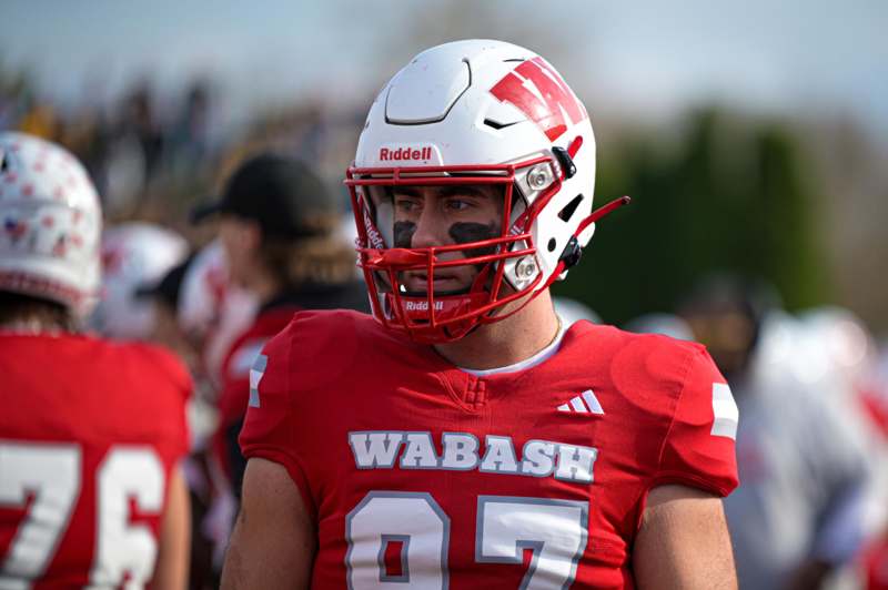 a football player wearing a red and white uniform