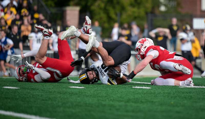 a group of people playing football