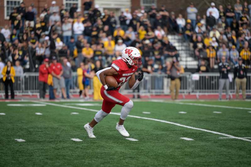 a football player running with a ball
