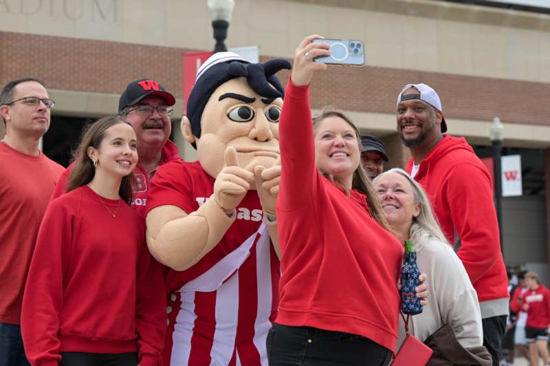a group of people taking a selfie