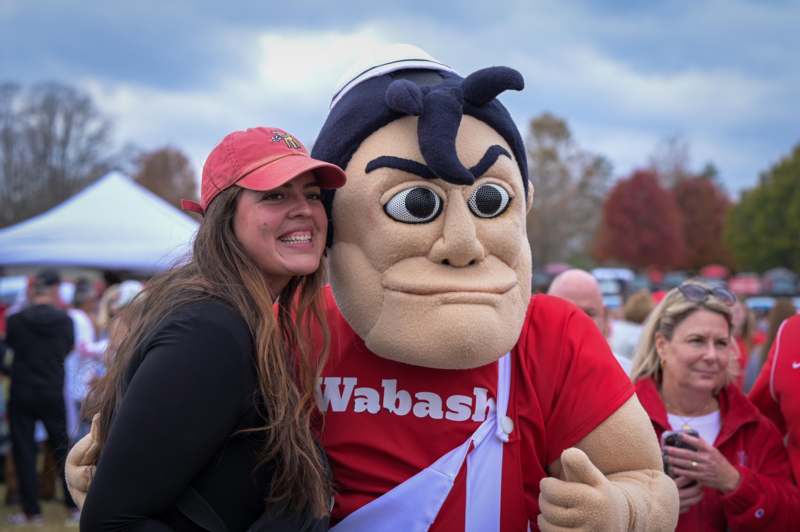 a woman posing with a person in a garment