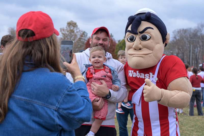 We Love Wally - a person in a garment with a child