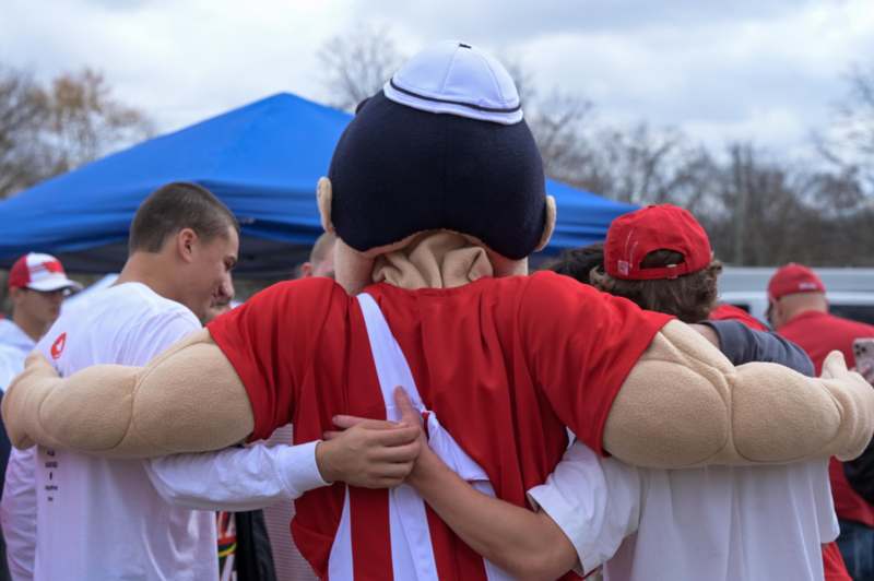 a person in a garment hugging another person