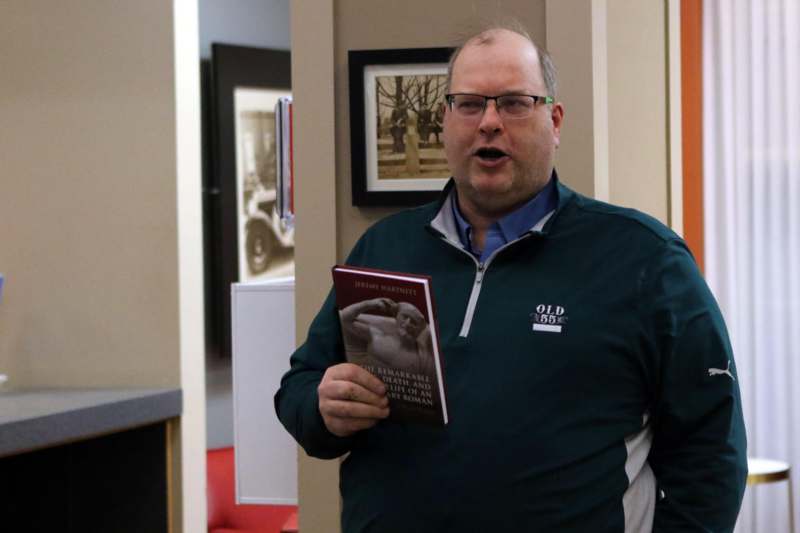 a man holding a book