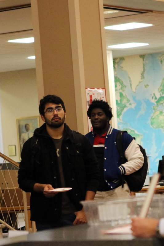 a group of men standing in a room