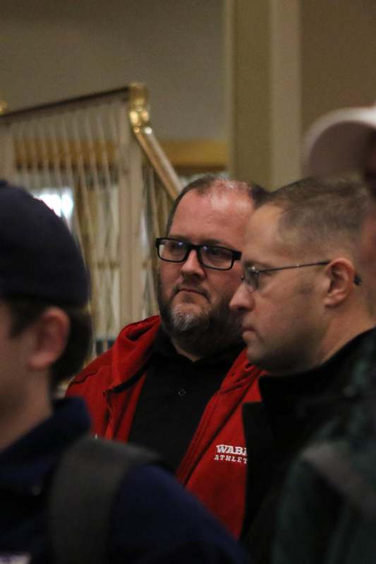 a group of men standing in a room