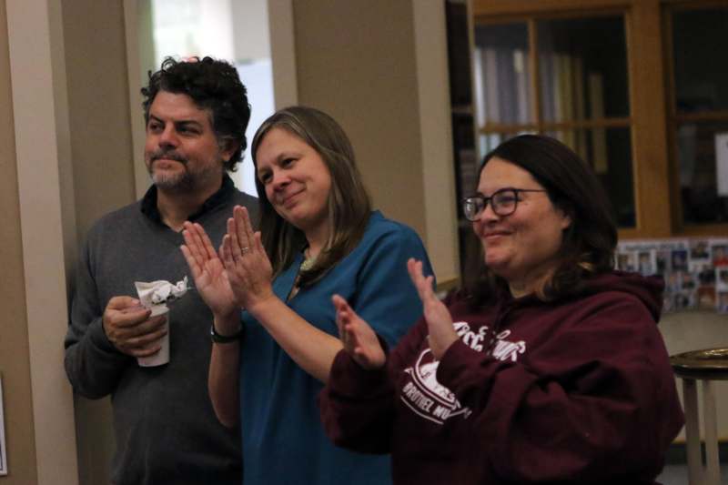 a group of people clapping
